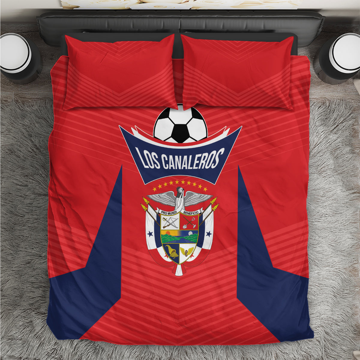 Red and navy football bedding set with soccer ball emblem on duvet, two red pillows