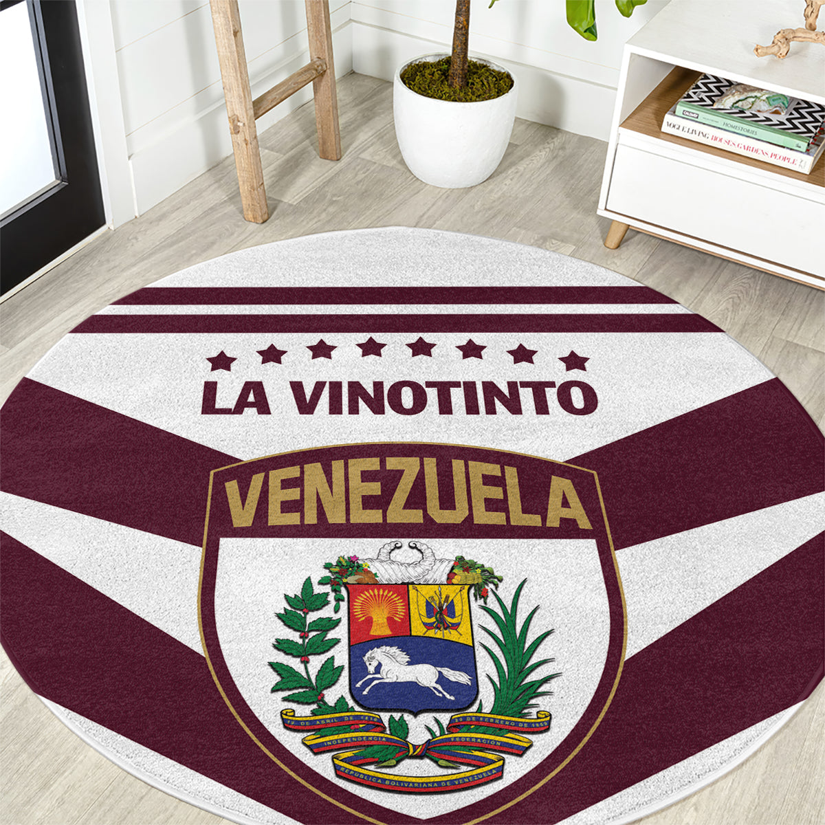 Round football carpet rug, maroon and white stripes with “LA VINOTINTO” and Venezuela crest