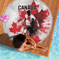 Round Canada soccer beach blanket with player graphic and maple leaves, fringe edging