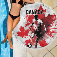 Round Canada soccer beach blanket with red-and-white player graphic by pool edge