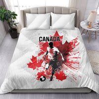 White duvet bedding set featuring red Canada soccer player graphic and two matching pillows