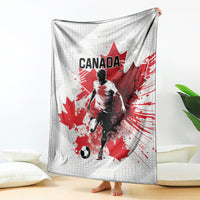 Canada soccer blanket, white-and-gray with large red maple leaf and player graphic