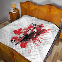 White quilted bedding blanket featuring Canada soccer player and red maple leaf graphic
