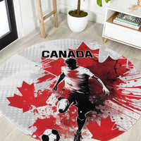 Light gray round Canada soccer carpet with Canada lettering, red maple leaf pattern, goalie art