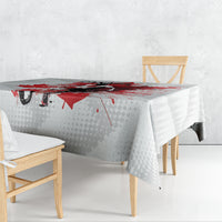 White tablecloth with Canada graphics: red splatter maple leaf and goalie silhouette