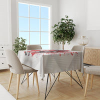 White Canada tablecloth with red maple leaf splatter and hockey goalie artwork