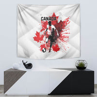 White tapestry showing Canada soccer player with red maple leaf splashes and Canada text