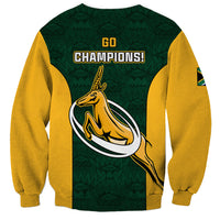 Green rugby sweatshirt with "GO CHAMPIONS!" text, springbok graphic, and yellow sleeves