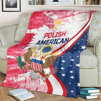 Red, white and blue throw blanket with Polish American eagle emblem and stars, on couch