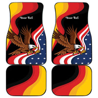 Black car floor mats with eagle, curved red/yellow stripes, and blue star flag graphic