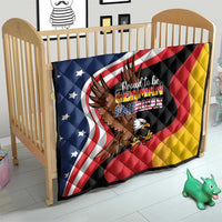 German-American eagle heritage quilt on a wooden crib bed with American flag colors