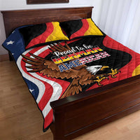 Black quilt bed set with eagle artwork and Proud to be German-American text, red yellow blue pattern.