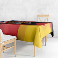 Eagle heritage tablecloth draped on dining table, red yellow and black graphic