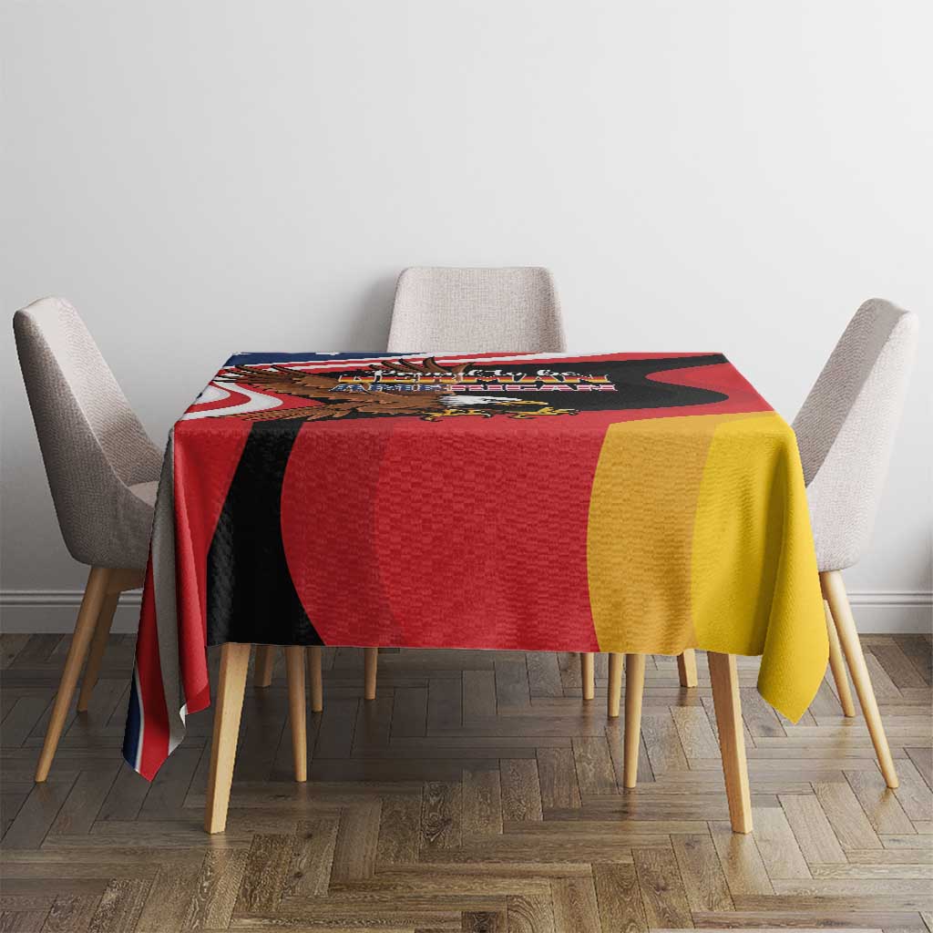 Eagle heritage tablecloth with black red yellow design, draped over chair-backed table