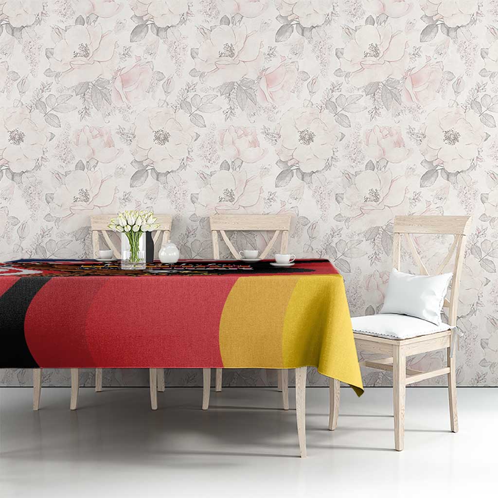 Eagle heritage tablecloth on long dining table, black red and yellow eagle design