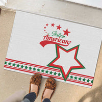 White rubber doormat showing Italian American text, star emblem, and green/red border