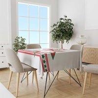 White star-themed tablecloth with red and green banner pattern on dining table