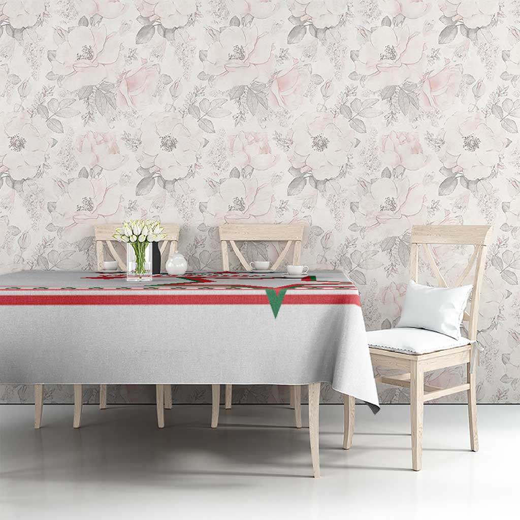 White tablecloth with red and green star border and stripe pattern center