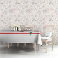 White tablecloth with red and green star border and stripe pattern center