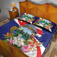 Blue tropical quilt bed set with two pillow shams and Costa Rica crest floral print