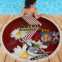 Round beach blanket with white fringe, red Latvia Independence Day design with daisy and bird