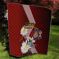 Red quilt with Latvian diagonal stripes, daisy flowers, crest emblem, and bird design
