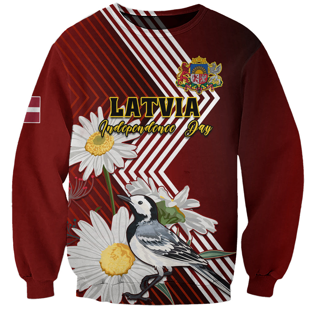 Red unisex sweatshirt with “Latvia Independence Day” text, wagtail and daisy graphic