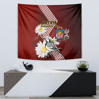 Red tapestry print with wagtail bird, daisies, Latvia text, and diagonal stripe pattern