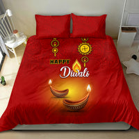 Red Diwali bedding set with paisley design, 'Happy Diwali' lettering and diya candle print