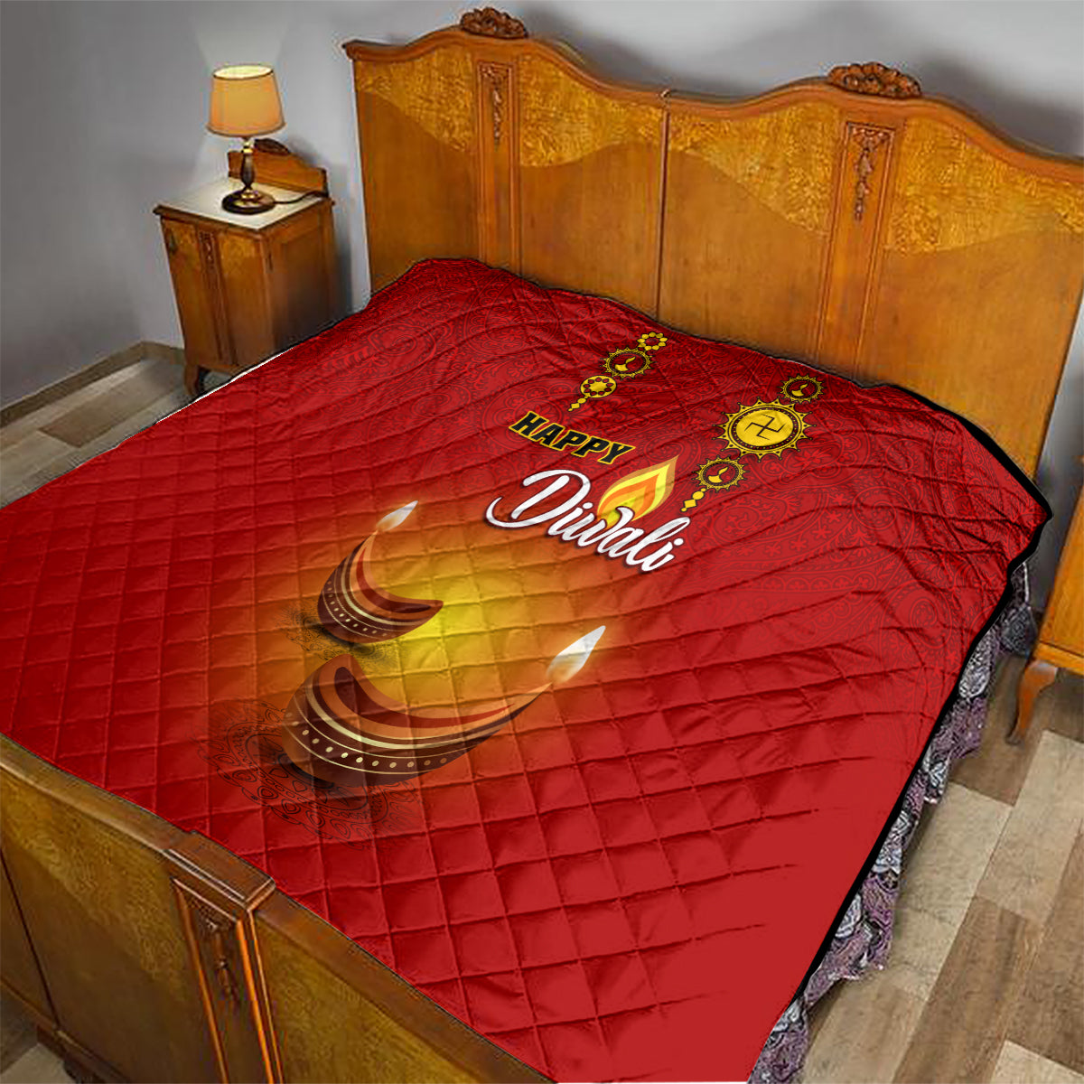 Red Diwali quilt with glowing diya design and Happy Diwali script on a bed