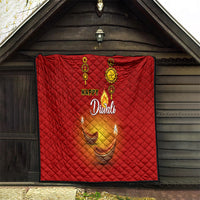 Red Diwali quilt hanging outdoors with Happy Diwali text and diya candle graphics