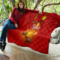 Red Diwali quilt draped on a seat with Happy Diwali text and diya candle icons