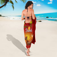 Red Diwali sarong with paisley pattern and Happy Diwali diya motif, worn