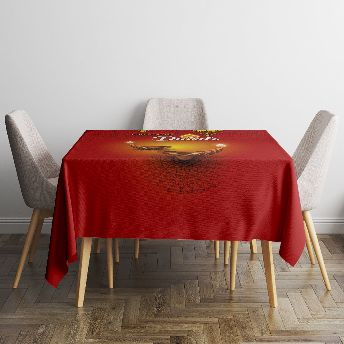 Red tablecloth with diya artwork and paisley motif, neatly set on dining table.