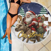 Round Christmas beach blanket with Santa and reindeer, gift box graphic, fringed edge