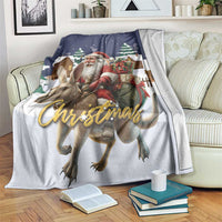 Christmas throw blanket over chair with Santa and reindeer, 'Christmas' script, navy and white
