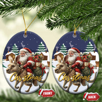 Two round ceramic Christmas ornaments with Santa riding kangaroo, gold hanging loops