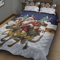 Christmas quilt with Santa and reindeer on white patchwork; navy accent border