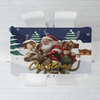 Navy Christmas tablecloth featuring Santa with a reindeer and the word 'Christmas'