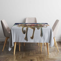 Gray Christmas tablecloth with reindeer-leg print across the tabletop