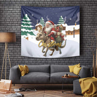 Christmas tapestry with Santa riding a reindeer over a snowy town scene