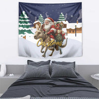 Christmas wall tapestry featuring Santa on a reindeer with trees and lantern lights