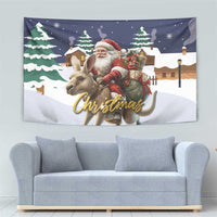 Christmas wall hanging with Santa riding a reindeer and a gold cursive 'Christmas' text