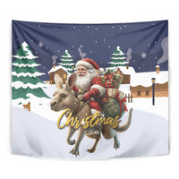 Christmas tapestry close view: Santa in a red hat riding a reindeer with gifts
