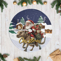 Fringed circular Christmas tree skirt with Santa and reindeer graphic, dark blue border