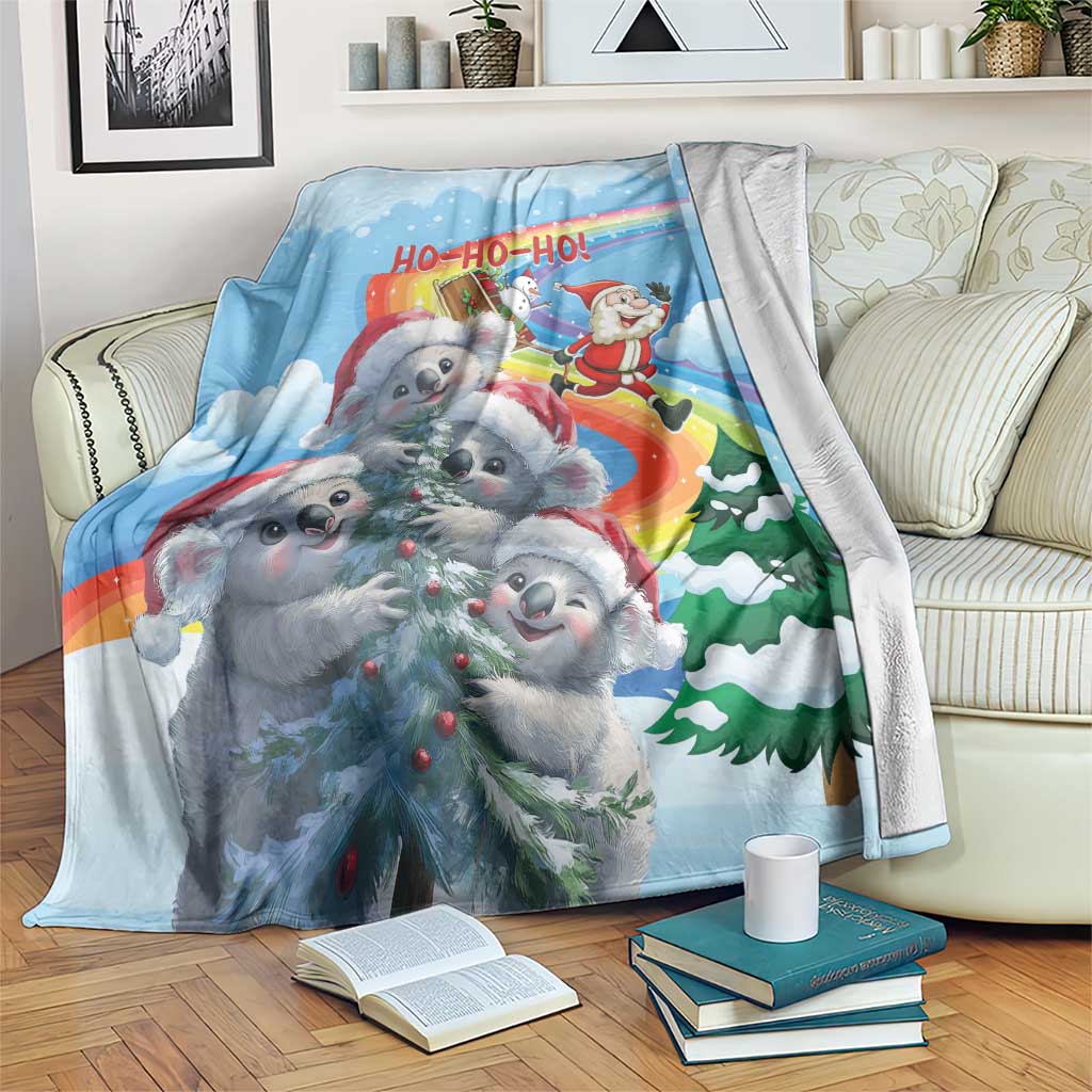 Blue Christmas blanket with cartoon koalas, Santa, and rainbow 'HO-HO-HO' graphic