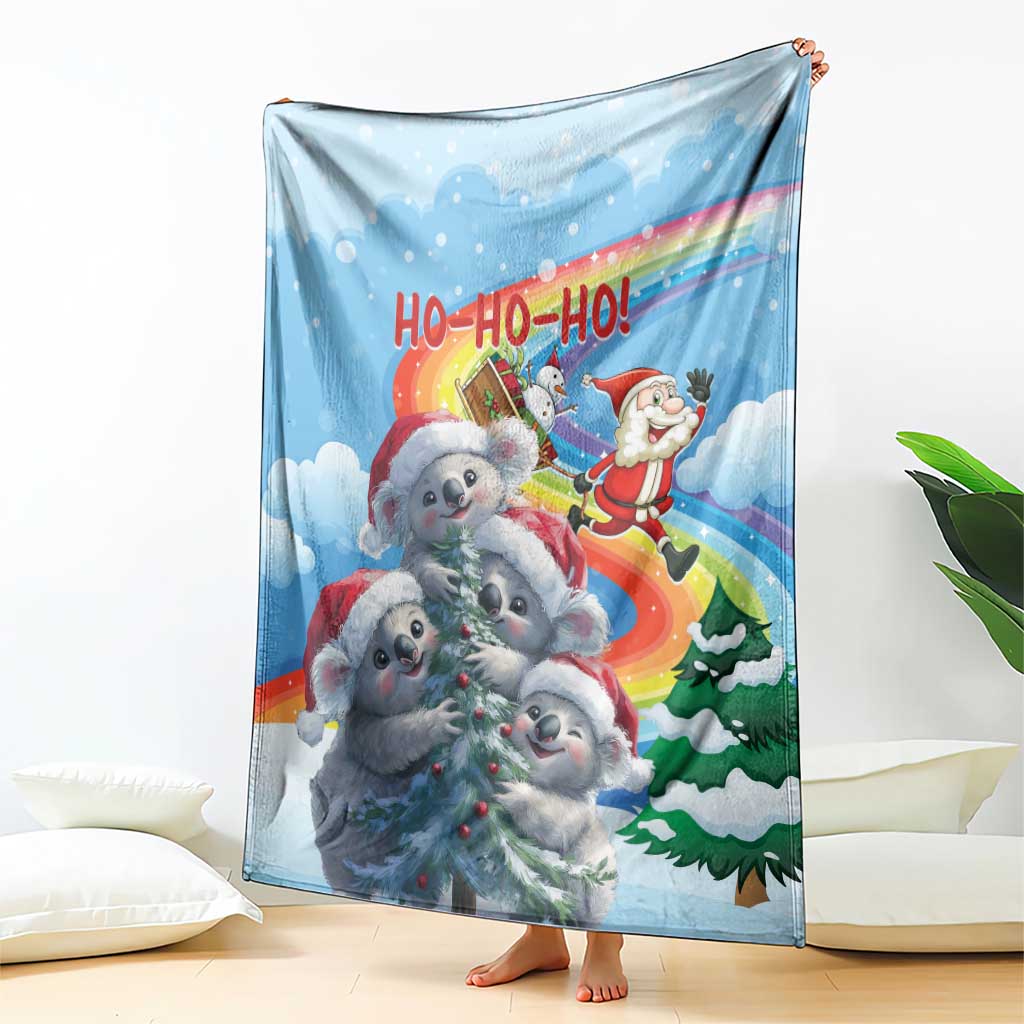 Blue Christmas blanket featuring koalas and Santa in a rainbow 'HO-HO-HO' scene