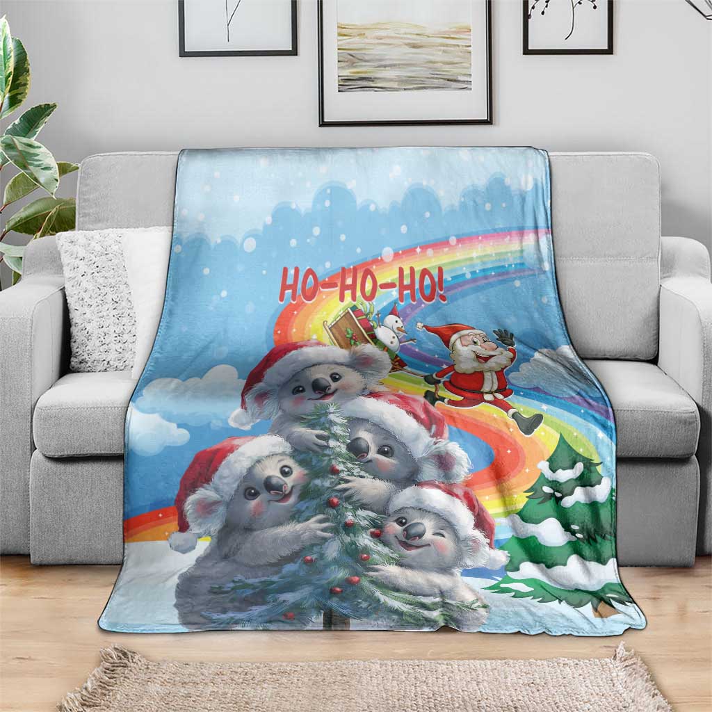 Blue Christmas blanket with koalas in red scarves, Santa, and rainbow 'HO-HO-HO' text