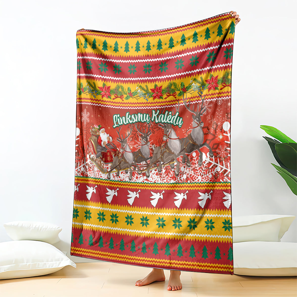 Red holiday blanket with reindeer, birds, trees, and 'Linksmu Kaledu' text
