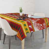 Christmas tablecloth on dining table, trees snowflakes reindeer holiday motif